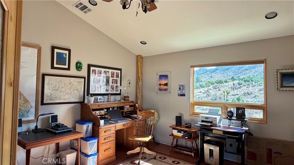 275 Canyon Road Pinon Hills, CA 92372 - Photo 23 of 68 a view of a workspace with furniture and a window