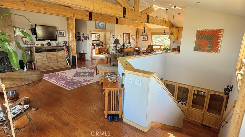 275 Canyon Road Pinon Hills, CA 92372 - Photo 26 of 68 a view of a living room with furniture and a flat screen tv