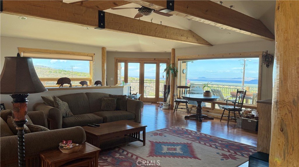 275 Canyon Road Pinon Hills, CA 92372 - Photo 27 of 68 a living room with furniture and a large window