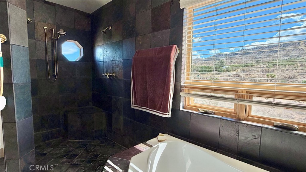 275 Canyon Road Pinon Hills, CA 92372 - Photo 34 of 68 a bathroom with a toilet and a shower
