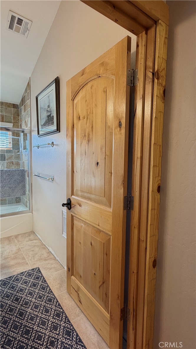 275 Canyon Road Pinon Hills, CA 92372 - Photo 37 of 68 a bathroom with a glass door shower