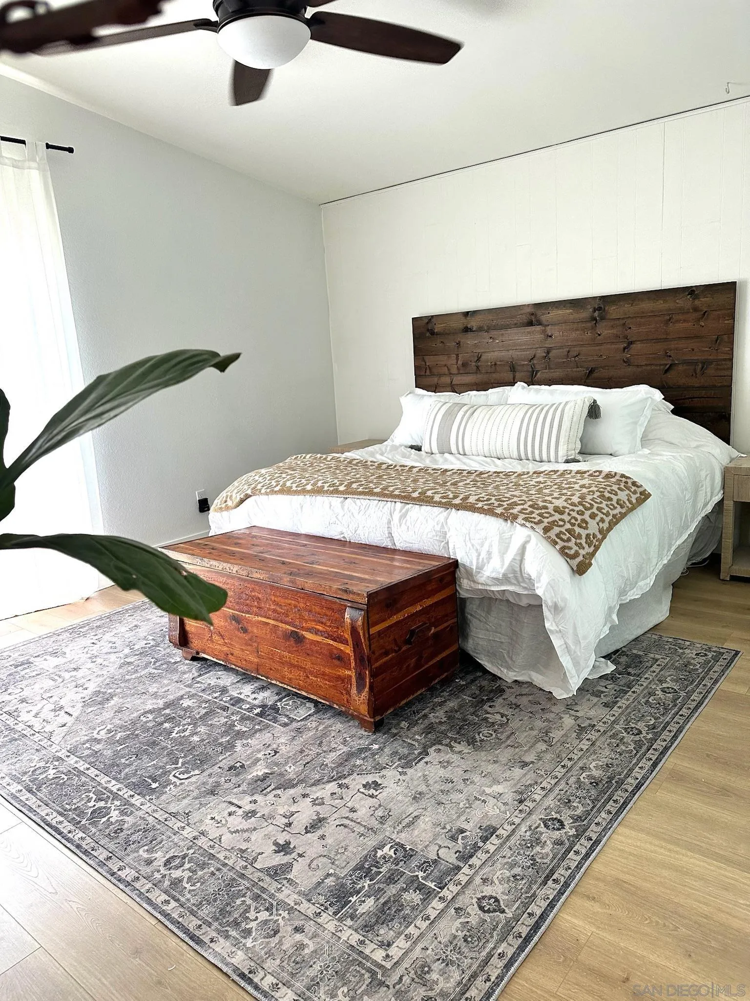 14240 Kendra Way Poway, CA 92064 - Photo 18 of 34 a bedroom with a bed and wooden floor