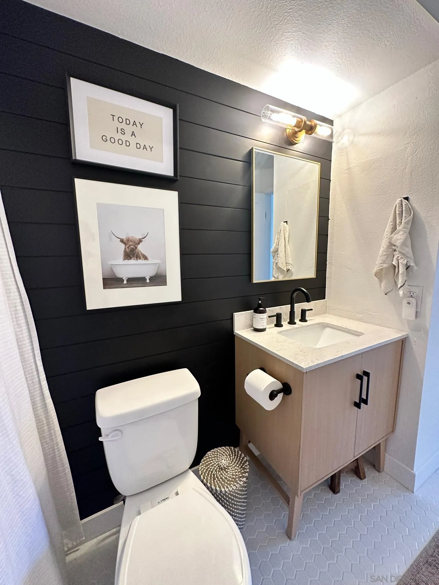 14240 Kendra Way Poway, CA 92064 - Photo 27 of 34 a bathroom with a toilet sink and mirror