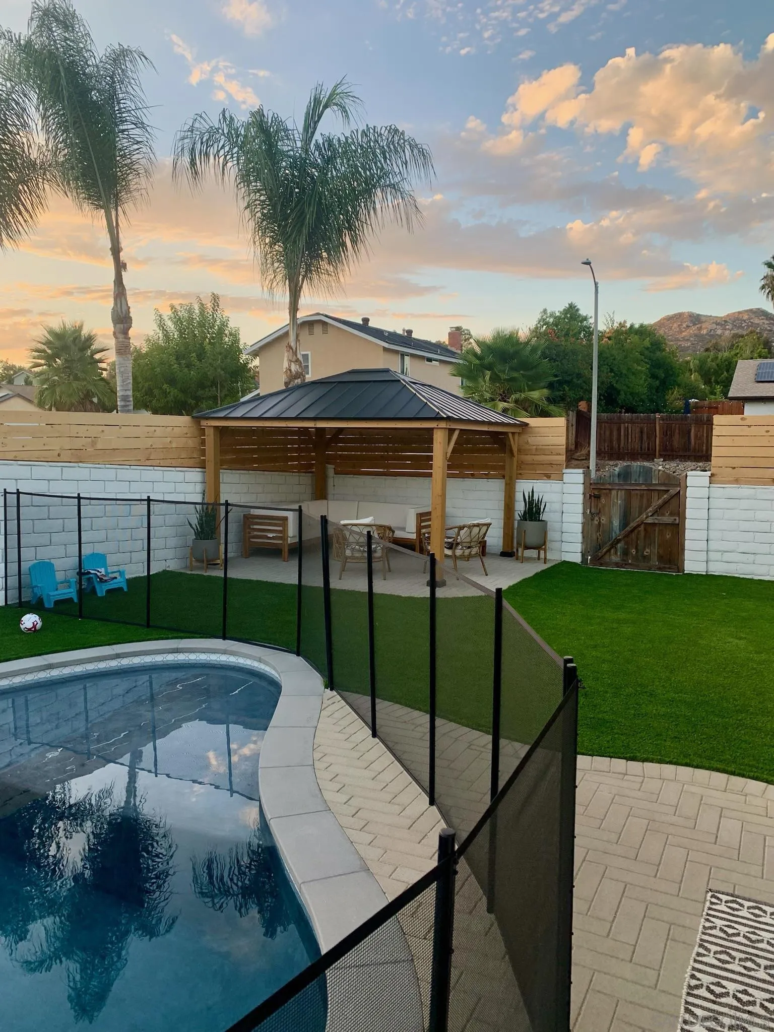 14240 Kendra Way Poway, CA 92064 - Photo 28 of 34 a view of a backyard with swimming pool and furniture