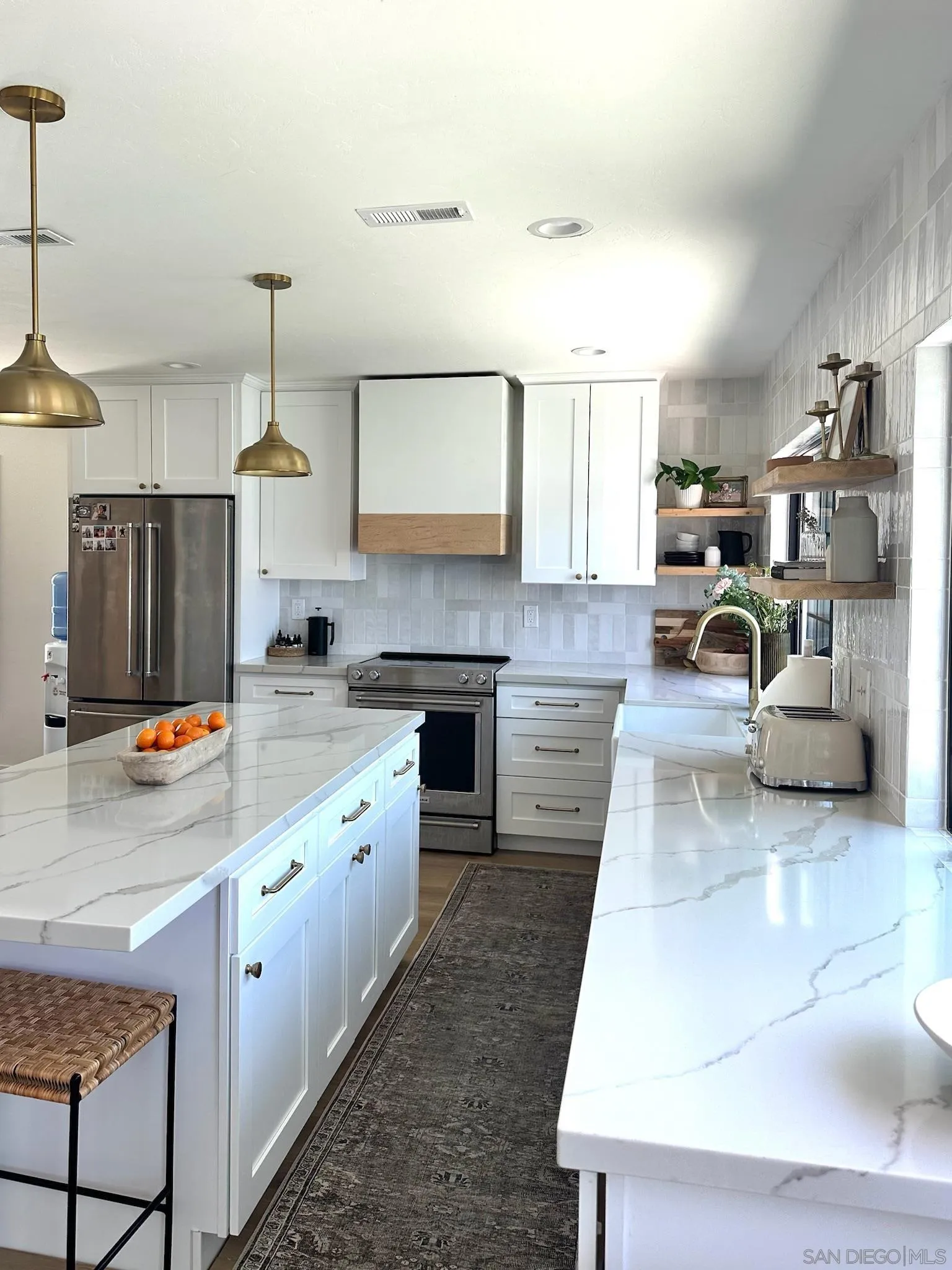 14240 Kendra Way Poway, CA 92064 - Photo 4 of 34 a kitchen with stainless steel appliances granite countertop a sink a stove and a refrigerator