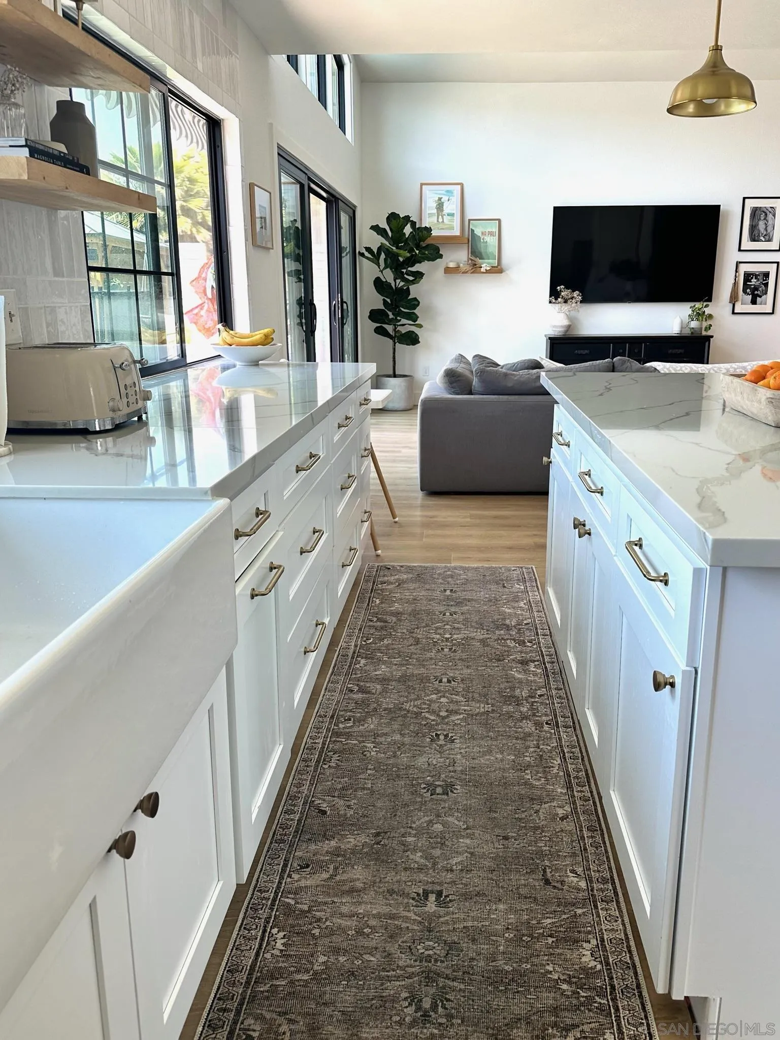 14240 Kendra Way Poway, CA 92064 - Photo 8 of 34 a large white kitchen with a large window