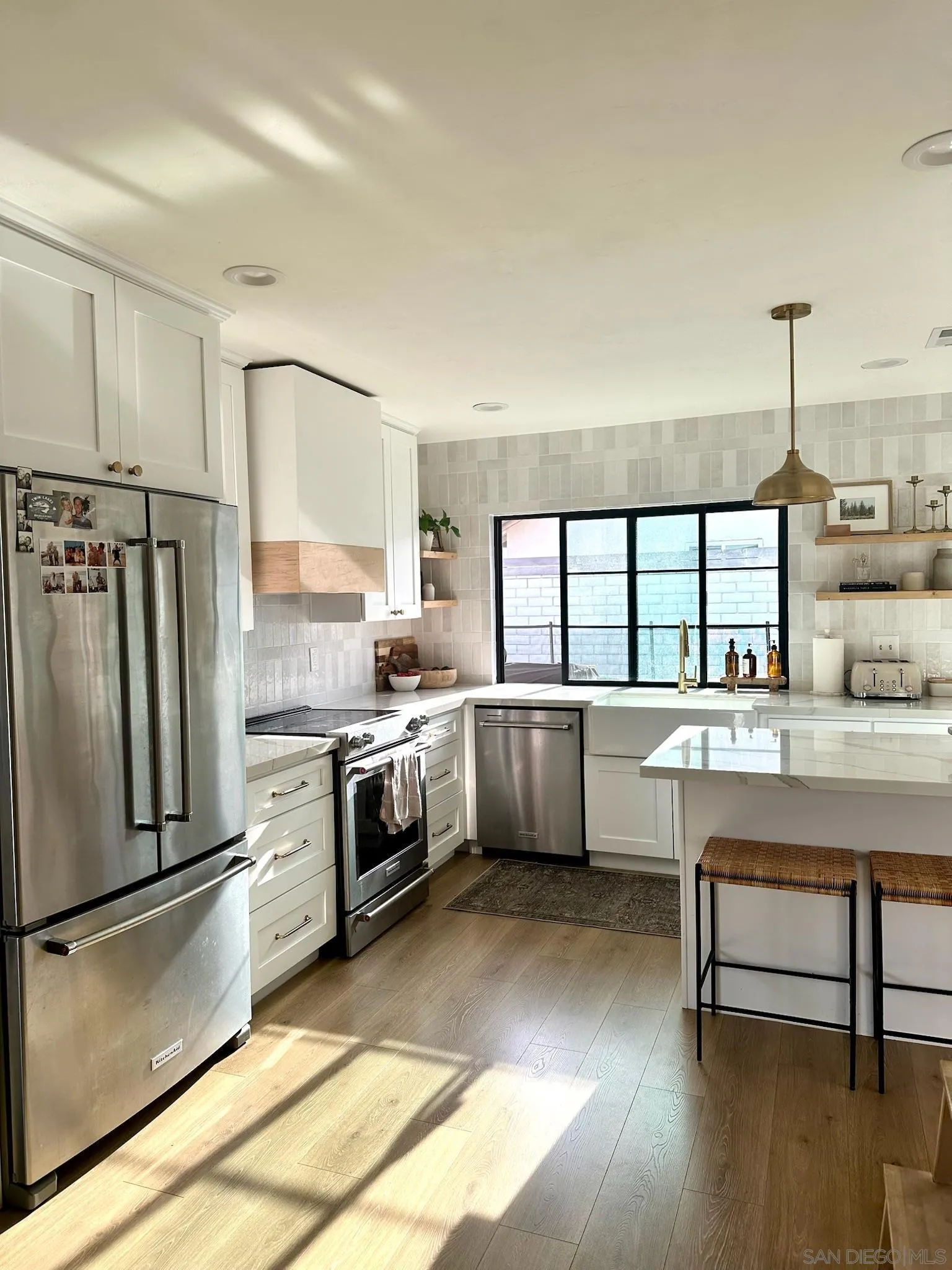 14240 Kendra Way Poway, CA 92064 - Photo 10 of 34 a kitchen with a sink cabinets and stainless steel appliances