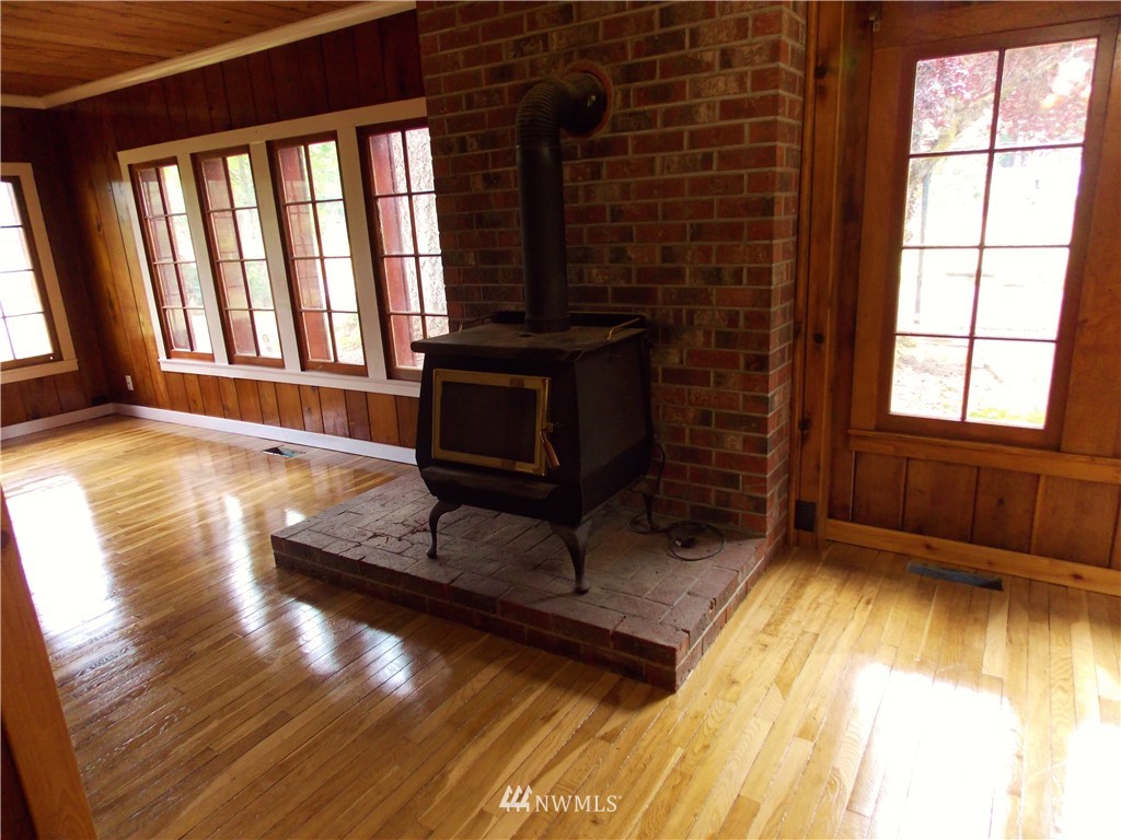 365 Chilvers Road Chehalis, WA 98532 - Photo 5 of 20 a view of an empty room with a fireplace and a window