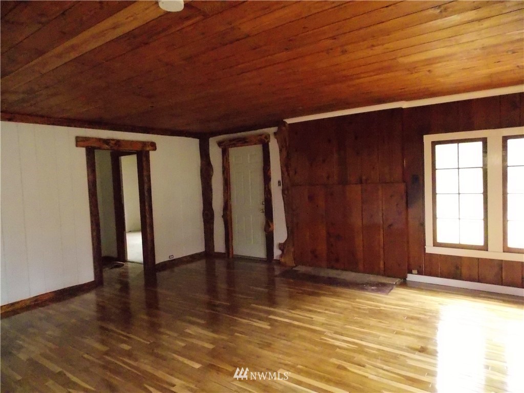 365 Chilvers Road Chehalis, WA 98532 - Photo 6 of 20 an empty room with wooden floor and windows