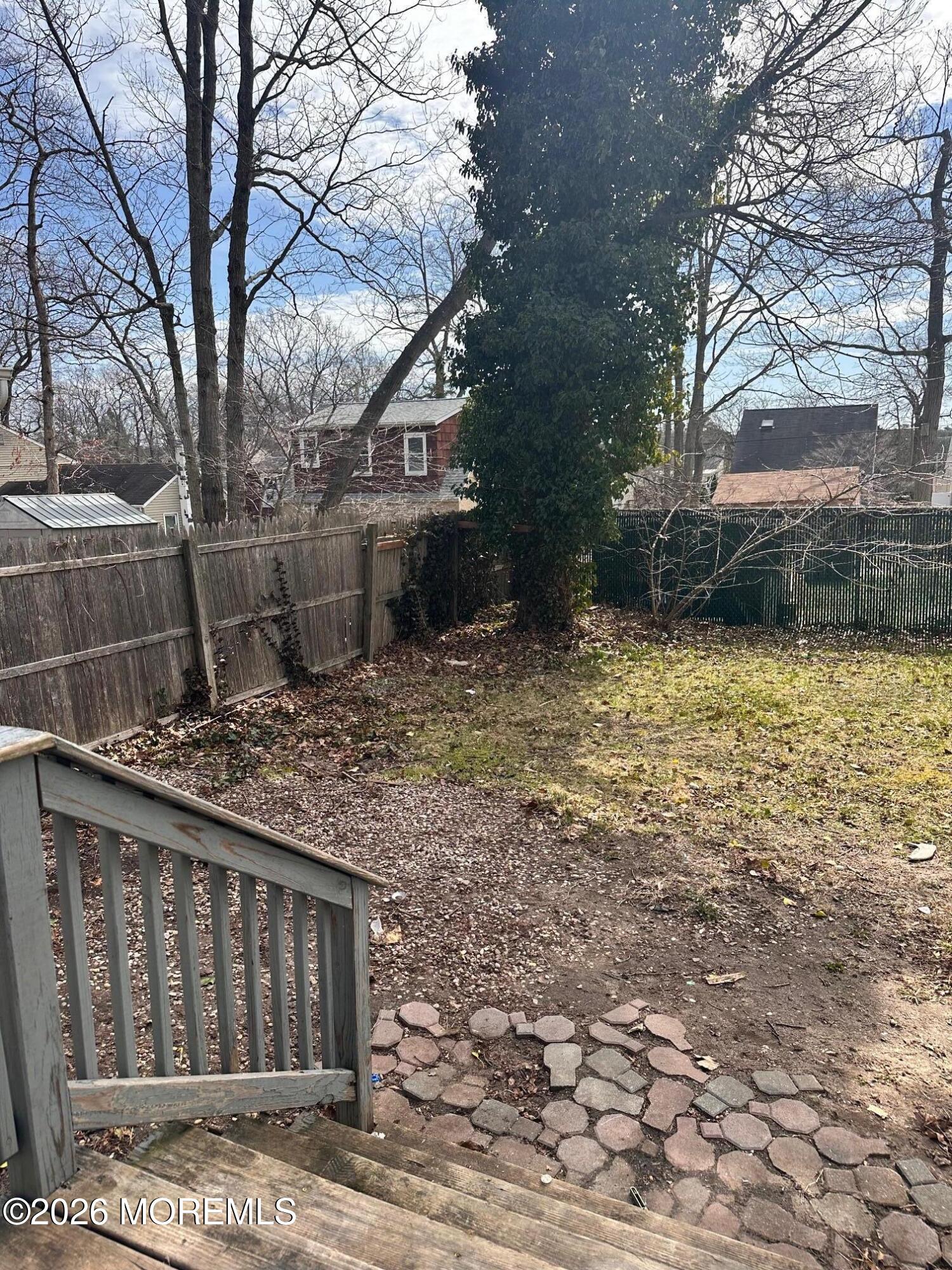 294 19th Avenue Brick, NJ 08724 - Photo 13 of 15 a backyard of a house with lots of green space