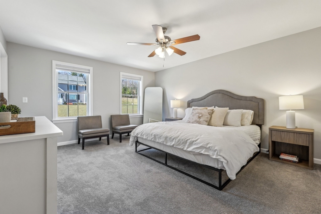 2 Oriole Drive Groton, MA 01450 - Photo 12 of 37 a spacious bedroom with a bed and a table