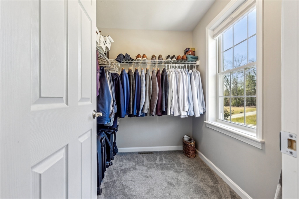 2 Oriole Drive Groton, MA 01450 - Photo 13 of 37 a view of walk in closet with clothes and shoes