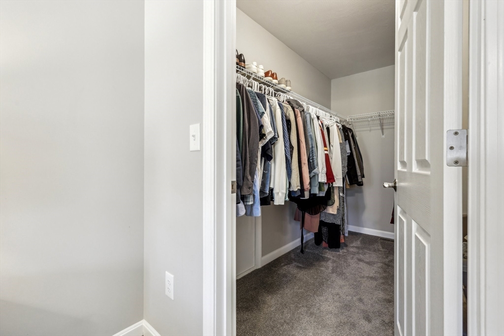 2 Oriole Drive Groton, MA 01450 - Photo 16 of 37 a view of walk in closet with clothes
