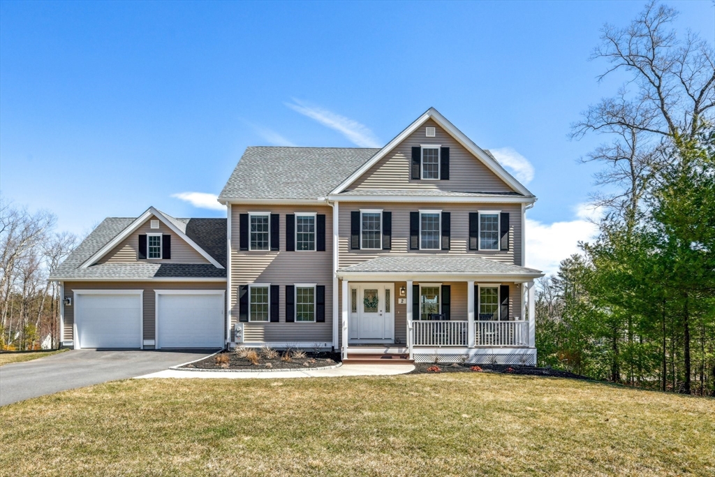 2 Oriole Drive Groton, MA 01450 - Photo 2 of 37 a front view of a house with a yard