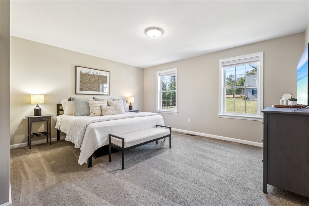 2 Oriole Drive Groton, MA 01450 - Photo 22 of 37 a bedroom with a bed lamps and window