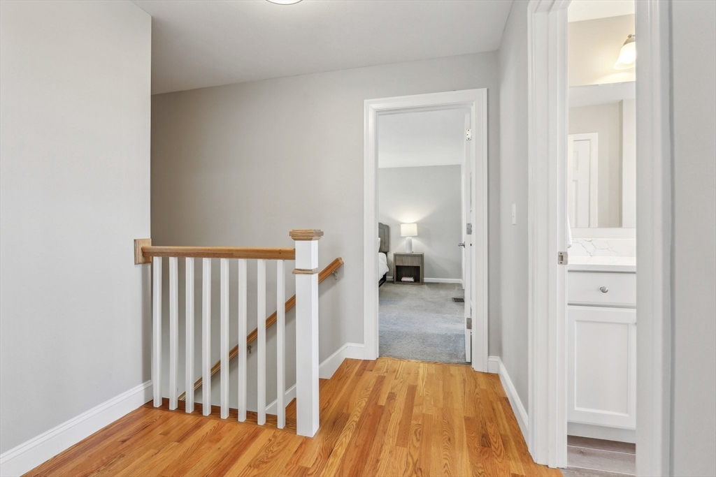 2 Oriole Drive Groton, MA 01450 - Photo 24 of 37 a view of a bedroom from a hallway
