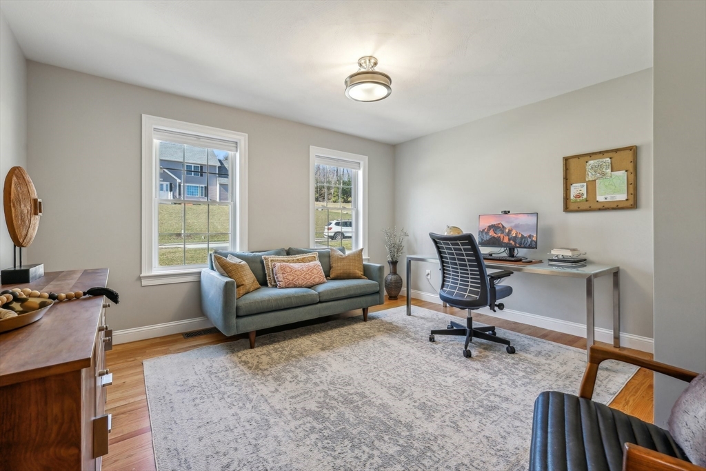 2 Oriole Drive Groton, MA 01450 - Photo 25 of 37 a living room with furniture a rug and a window
