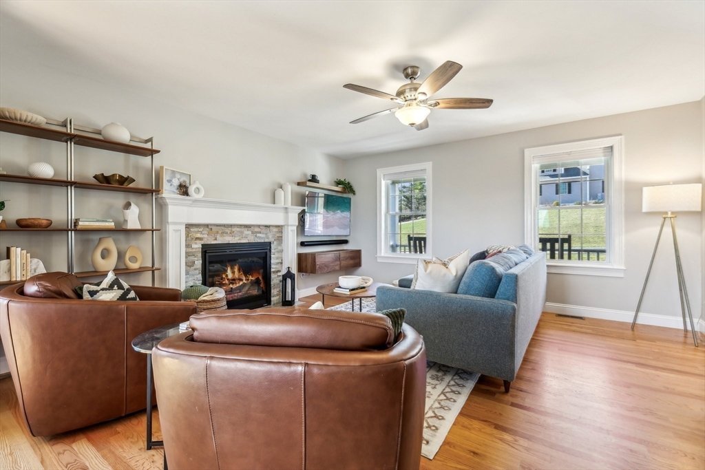 2 Oriole Drive Groton, MA 01450 - Photo 8 of 37 a living room with furniture a fireplace and a window