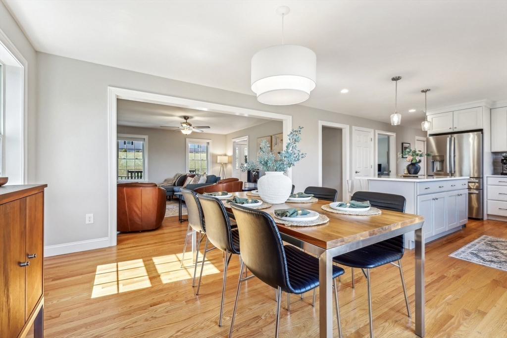 2 Oriole Drive Groton, MA 01450 - Photo 9 of 37 a view of a dining room with furniture and a wooden floor