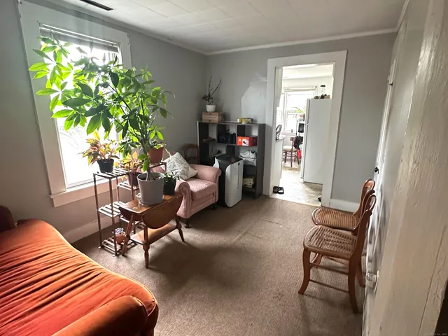 a bedroom with furniture and a window