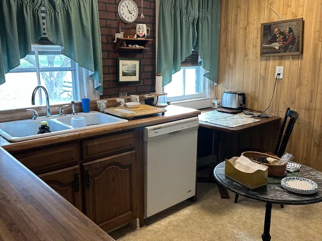 a kitchen with a sink and a stove