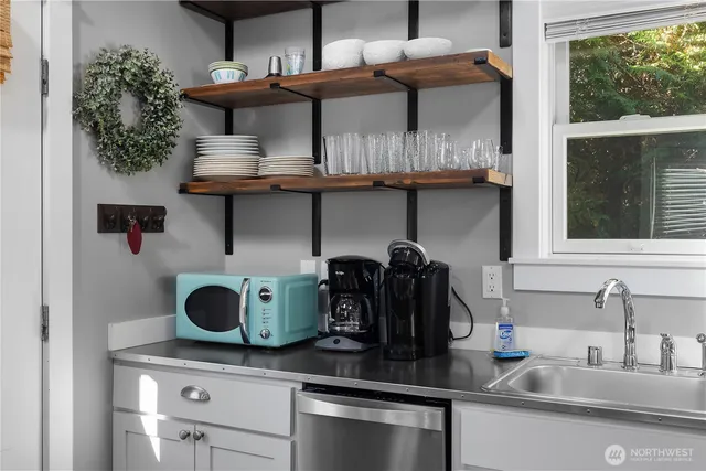 a kitchen with a stove and a wooden cabinets