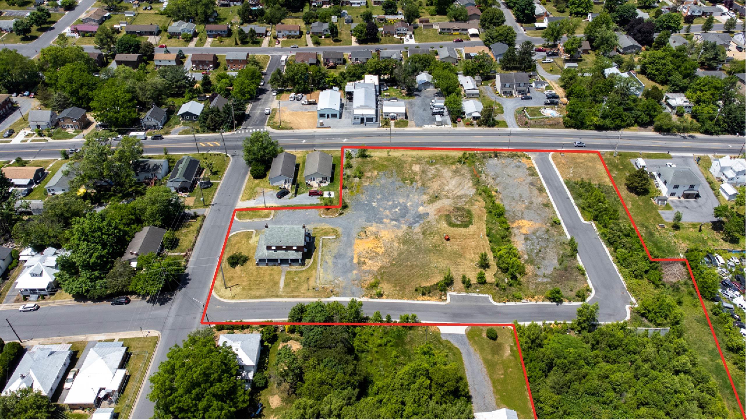 an aerial view of residential house with outdoor space and swimming pool
