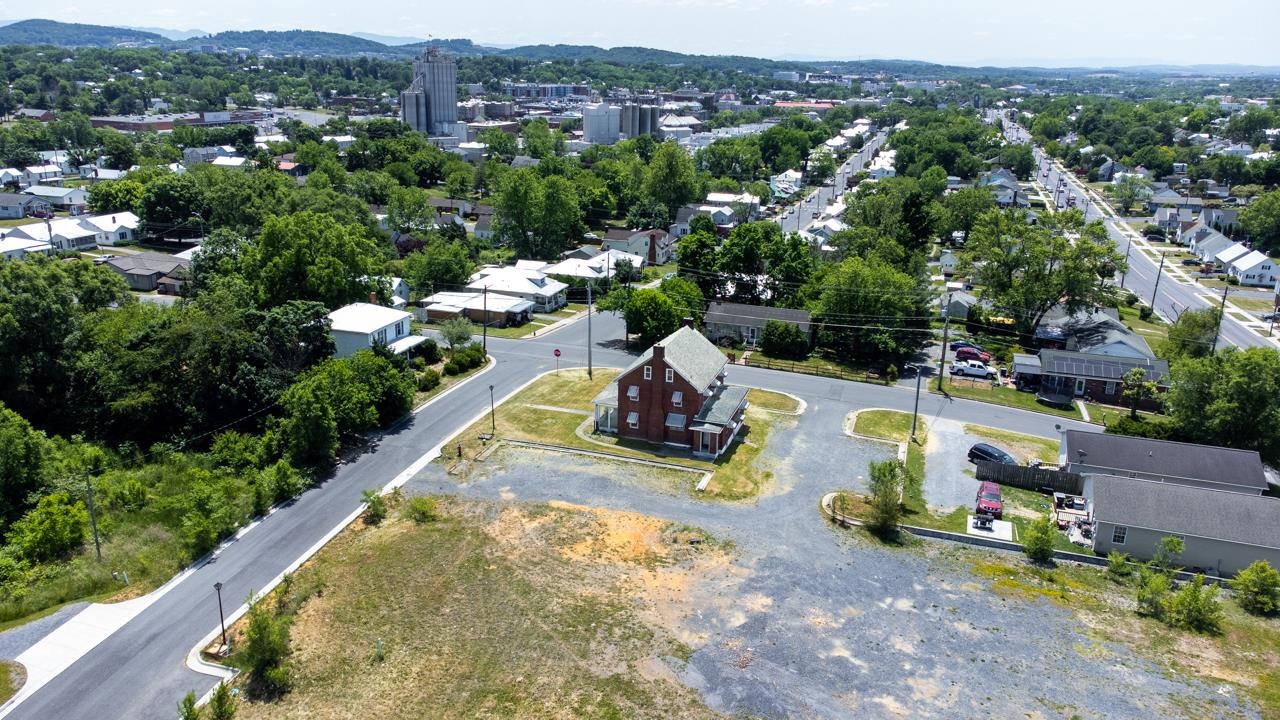 919 Collicello Street Harrisonburg, VA 22802 - Photo 17 of 30 an aerial view of a swimming pool with a yard and mountain view in back