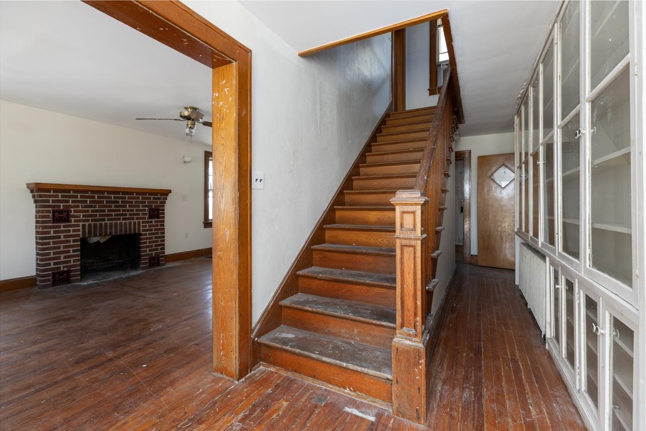 919 Collicello Street Harrisonburg, VA 22802 - Photo 24 of 30 a view of an entryway with wooden floor and a fireplace