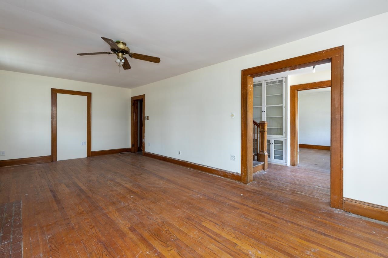 919 Collicello Street Harrisonburg, VA 22802 - Photo 26 of 30 a view of a livingroom with a hardwood floor and a ceiling fan