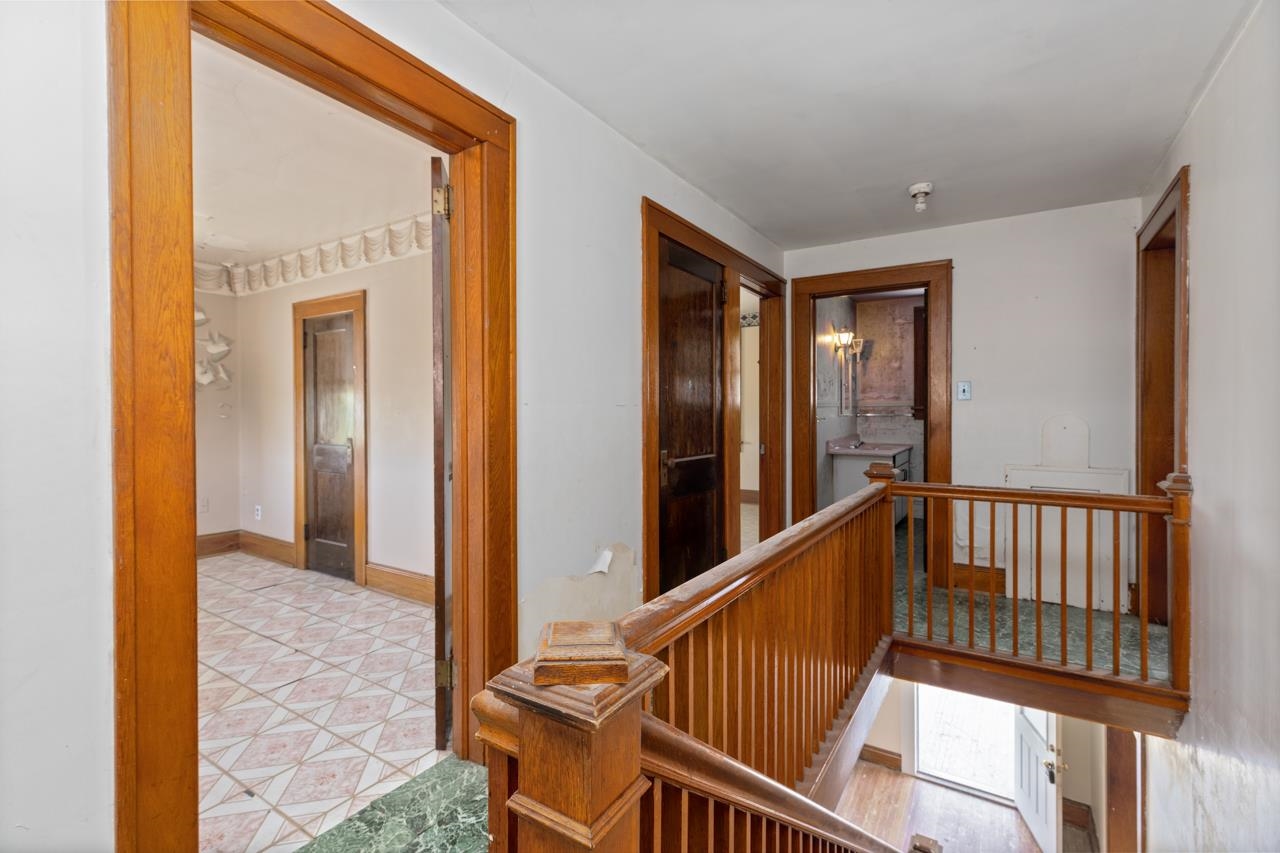 919 Collicello Street Harrisonburg, VA 22802 - Photo 27 of 30 a view of a hallway with wooden floor and windows