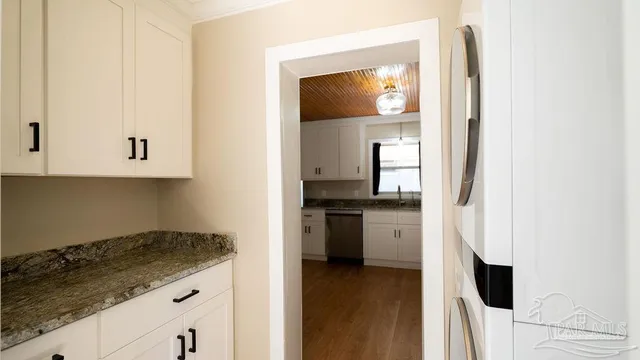 a view of a kitchen with washer and dryer