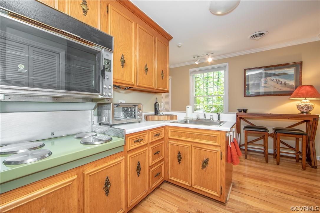 2911 West Brigstock Road Midlothian, VA 23113 - Photo 18 of 50 a kitchen with stainless steel appliances granite countertop a sink and cabinets