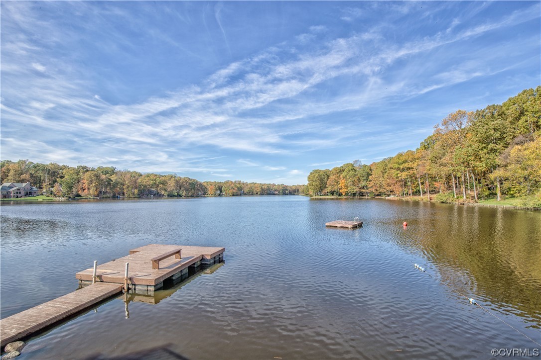 2911 West Brigstock Road Midlothian, VA 23113 - Photo 48 of 50 a view of a lake with lawn chairs