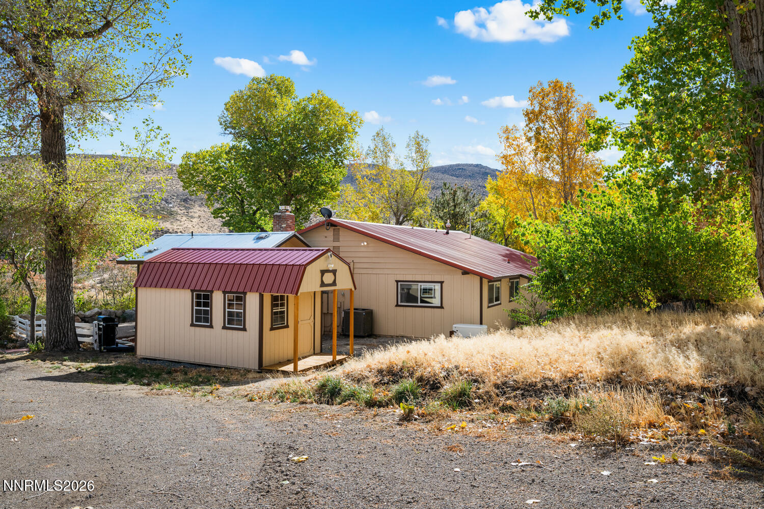 14005 North Red Rock Road Reno, NV 89508 - Photo 20 of 51 a front view of a house with a yard and garage