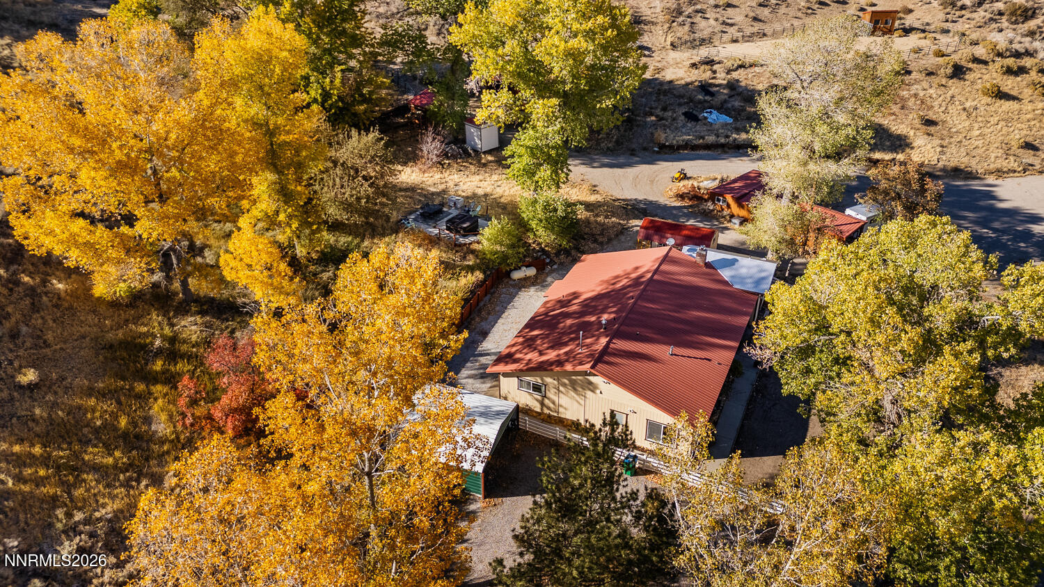 14005 North Red Rock Road Reno, NV 89508 - Photo 22 of 51 a view of a yard with plants and wooden fence