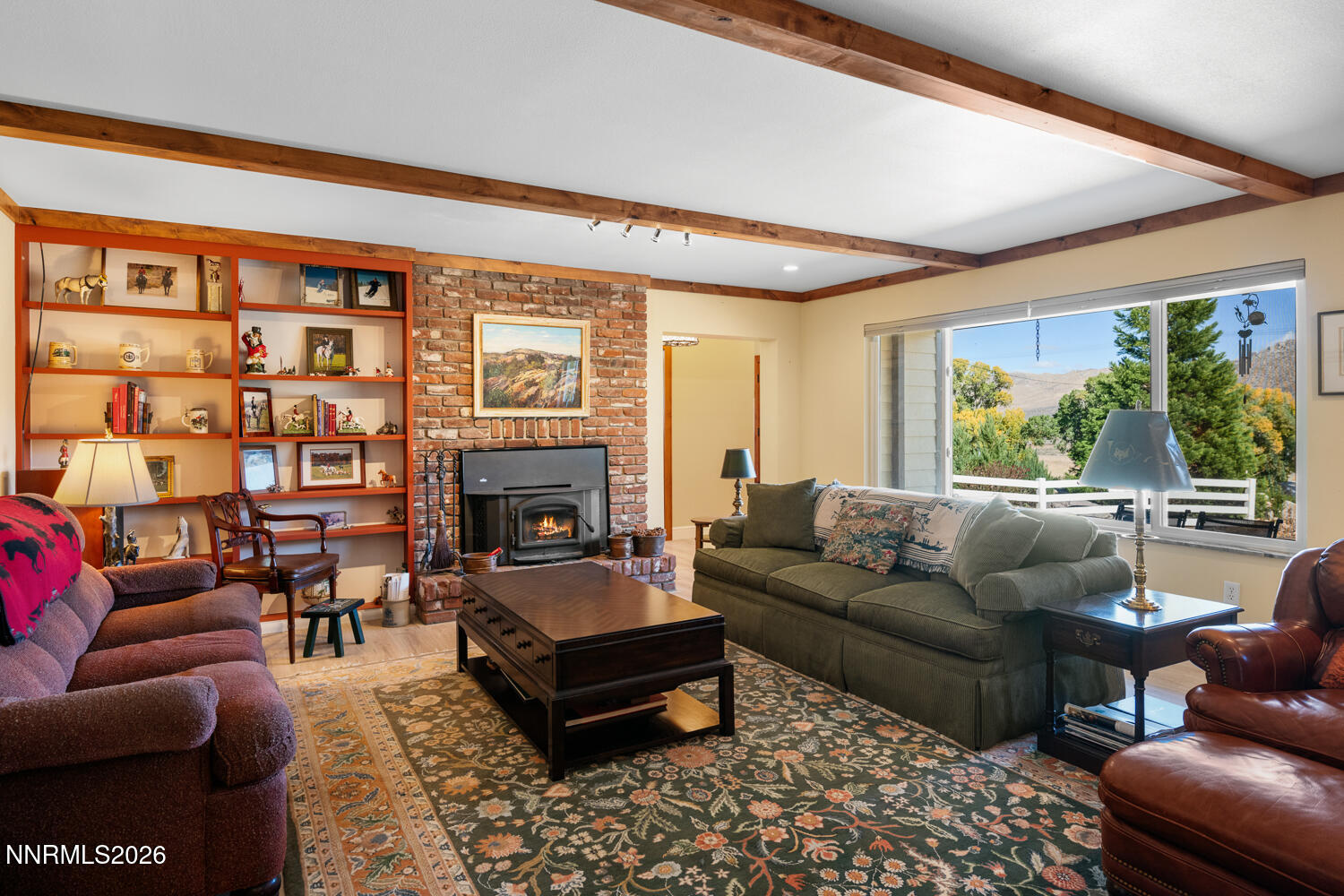 14005 North Red Rock Road Reno, NV 89508 - Photo 30 of 51 a living room with furniture fireplace and a large window
