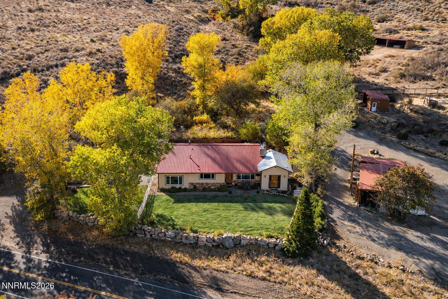 14005 North Red Rock Road Reno, NV 89508 - Photo 3 of 51 a view of house with garden space and sitting area