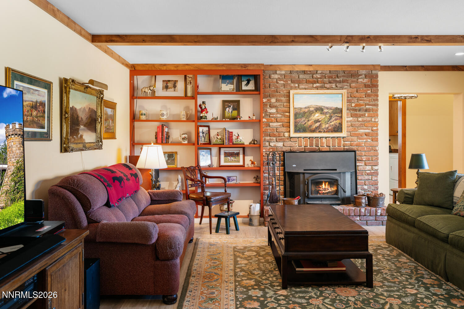 14005 North Red Rock Road Reno, NV 89508 - Photo 31 of 51 a living room with furniture a fireplace and a floor to ceiling window