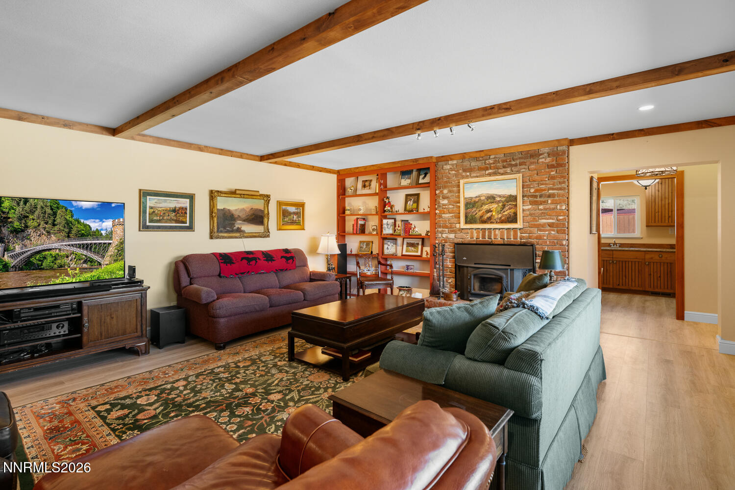 14005 North Red Rock Road Reno, NV 89508 - Photo 32 of 51 a living room with furniture fireplace and a table