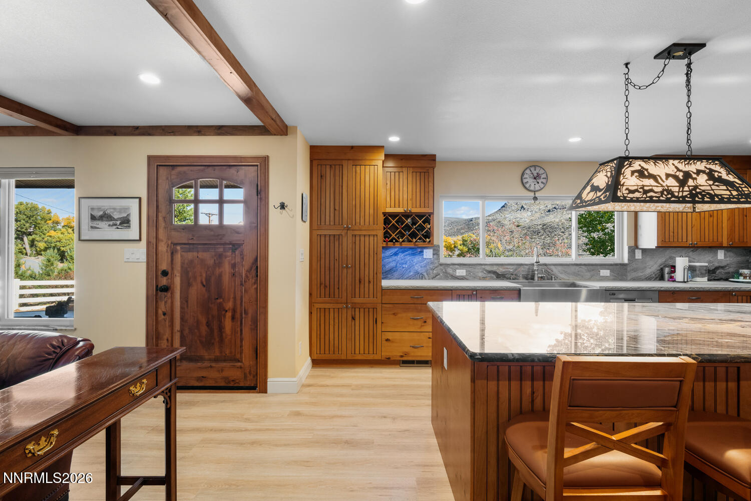 14005 North Red Rock Road Reno, NV 89508 - Photo 36 of 51 a kitchen with kitchen island granite countertop wooden floors and a view of living room