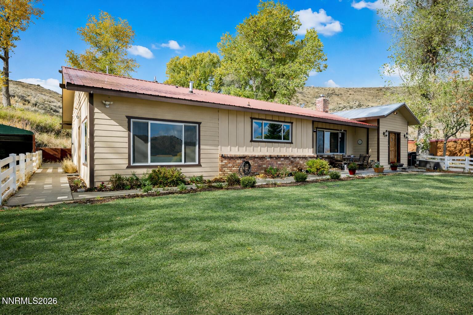 14005 North Red Rock Road Reno, NV 89508 - Photo 4 of 51 a front view of house with yard and green space