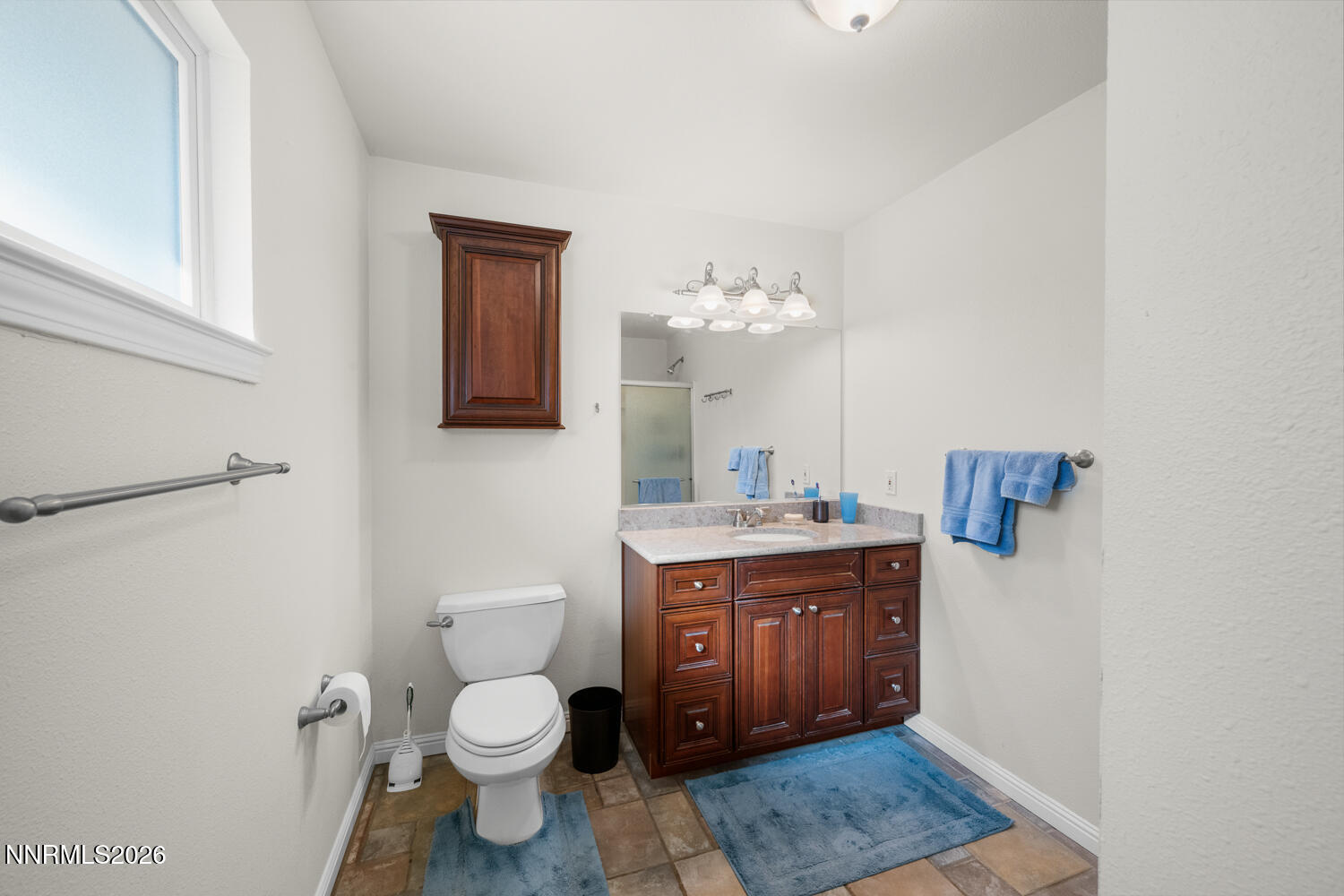 14005 North Red Rock Road Reno, NV 89508 - Photo 47 of 51 a spacious bathroom with a toilet a sink and mirror