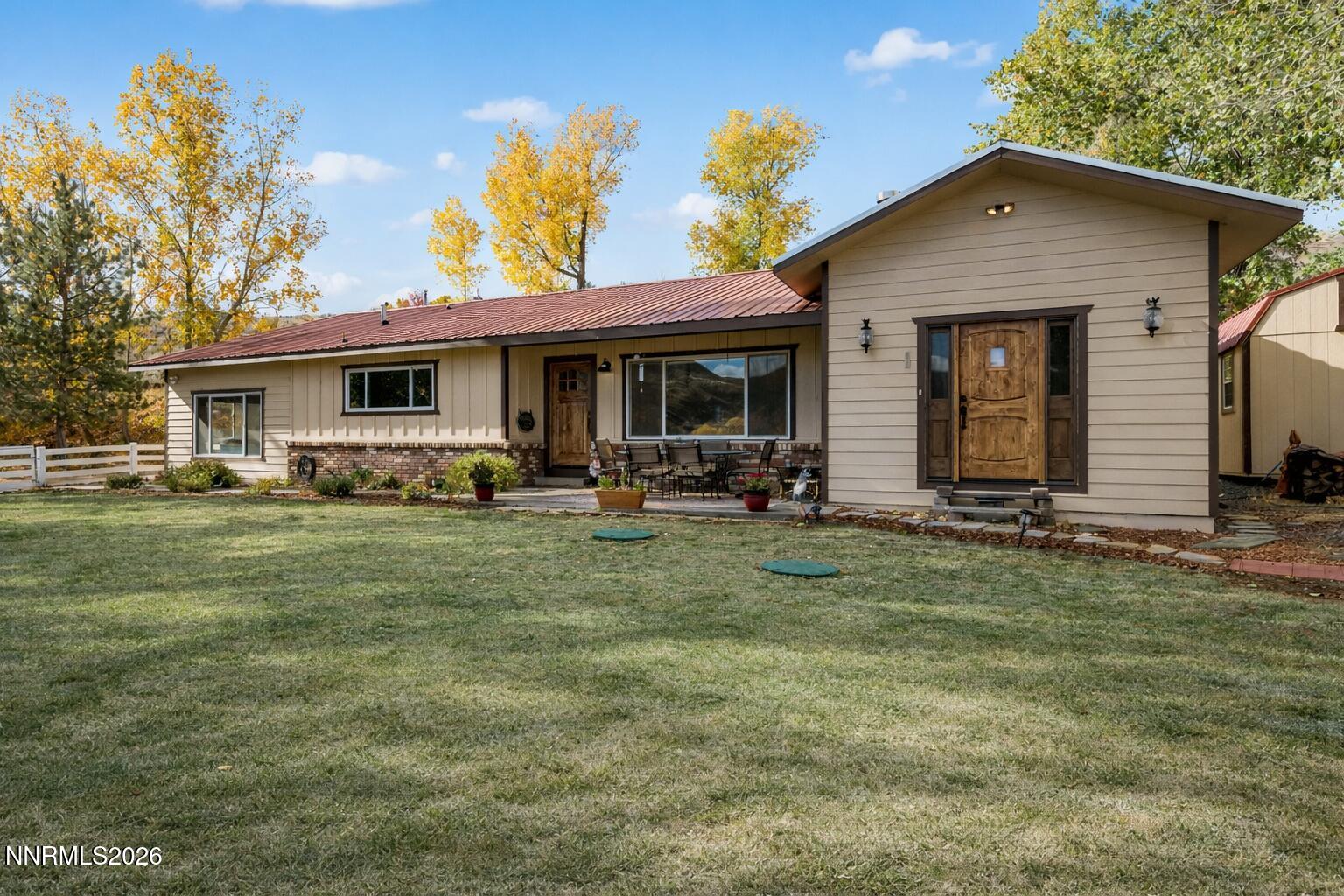 14005 North Red Rock Road Reno, NV 89508 - Photo 5 of 51 a front view of a house with garden