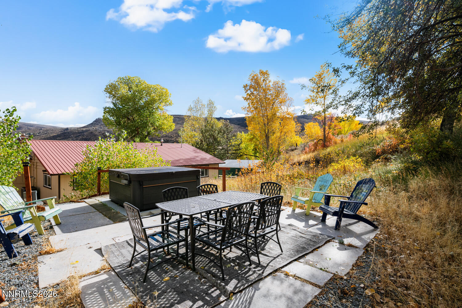 14005 North Red Rock Road Reno, NV 89508 - Photo 6 of 51 a view of a patio with table and chairs with wooden floor and fence