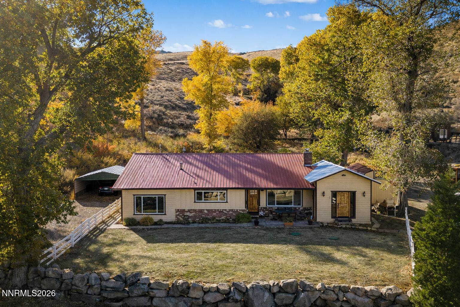 14005 North Red Rock Road Reno, NV 89508 - Photo 10 of 51 a front view of a house with yard and mountain view