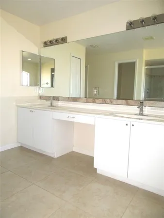 a spacious bathroom with a bathtub and a shower