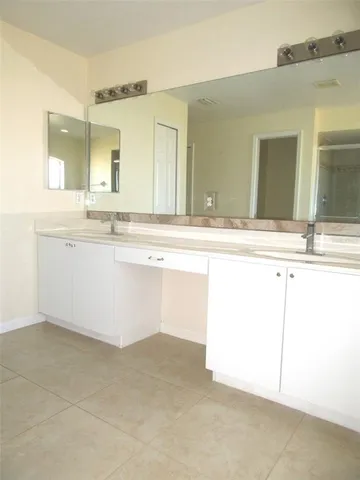 a spacious bathroom with a bathtub and a shower