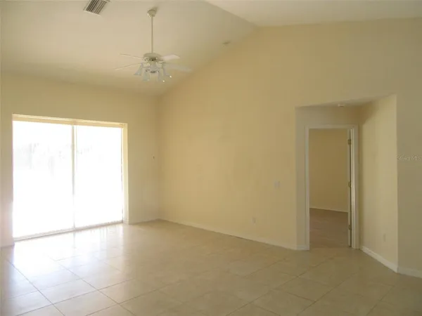 an empty room with a windows