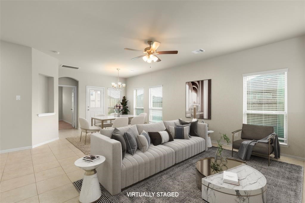 1333 Red Hills Drive Rosharon, TX 77583 - Photo 29 of 29 a living room with furniture a large window and a chandelier